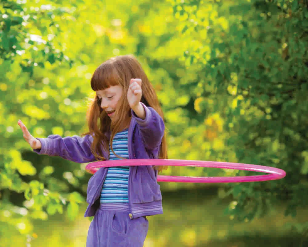 Happy,Girl,With,Red,Hair,With,A,Hula-hoops